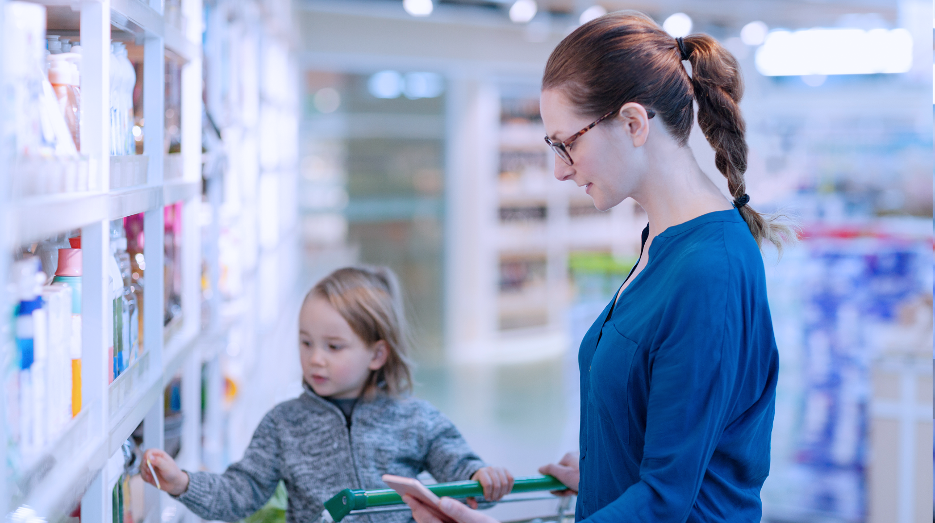 A young mother and her child in a drugstore