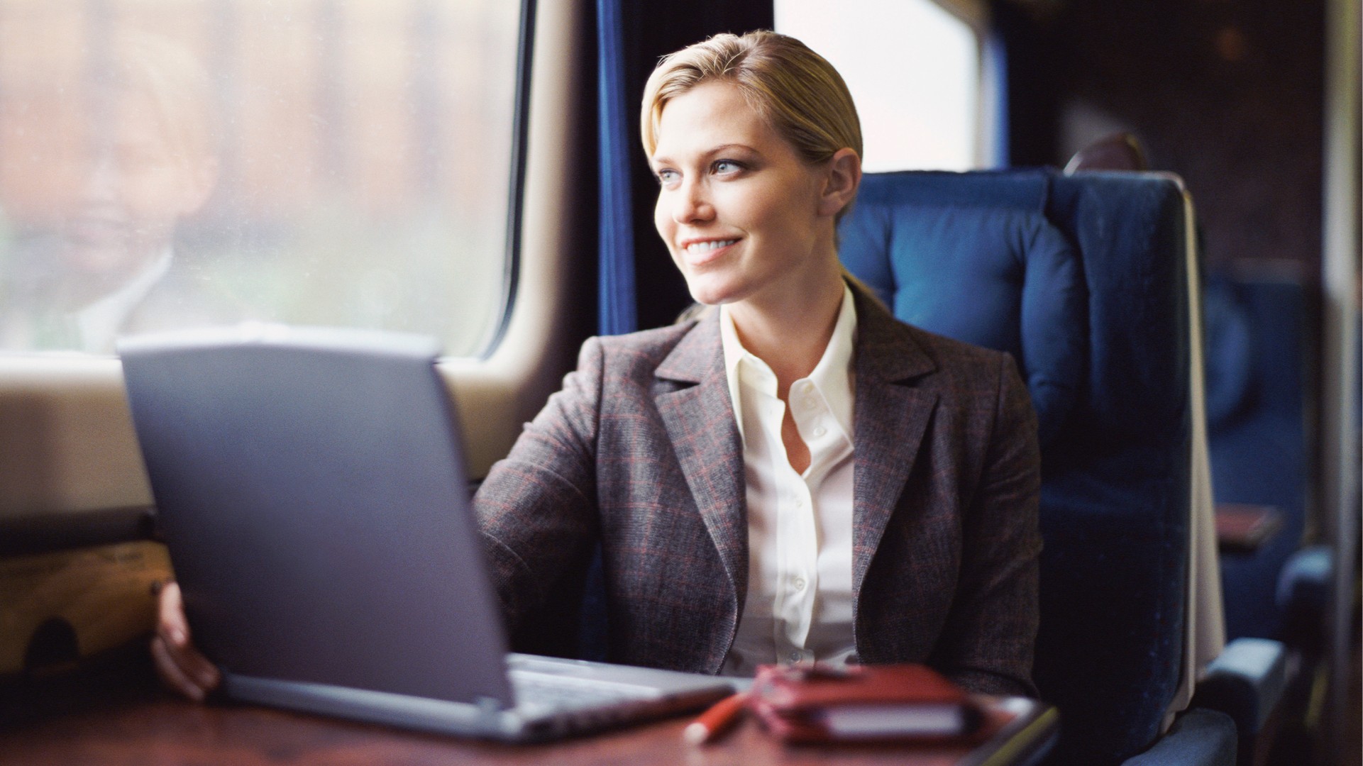 Accessibility: Woman on a laptop on a train