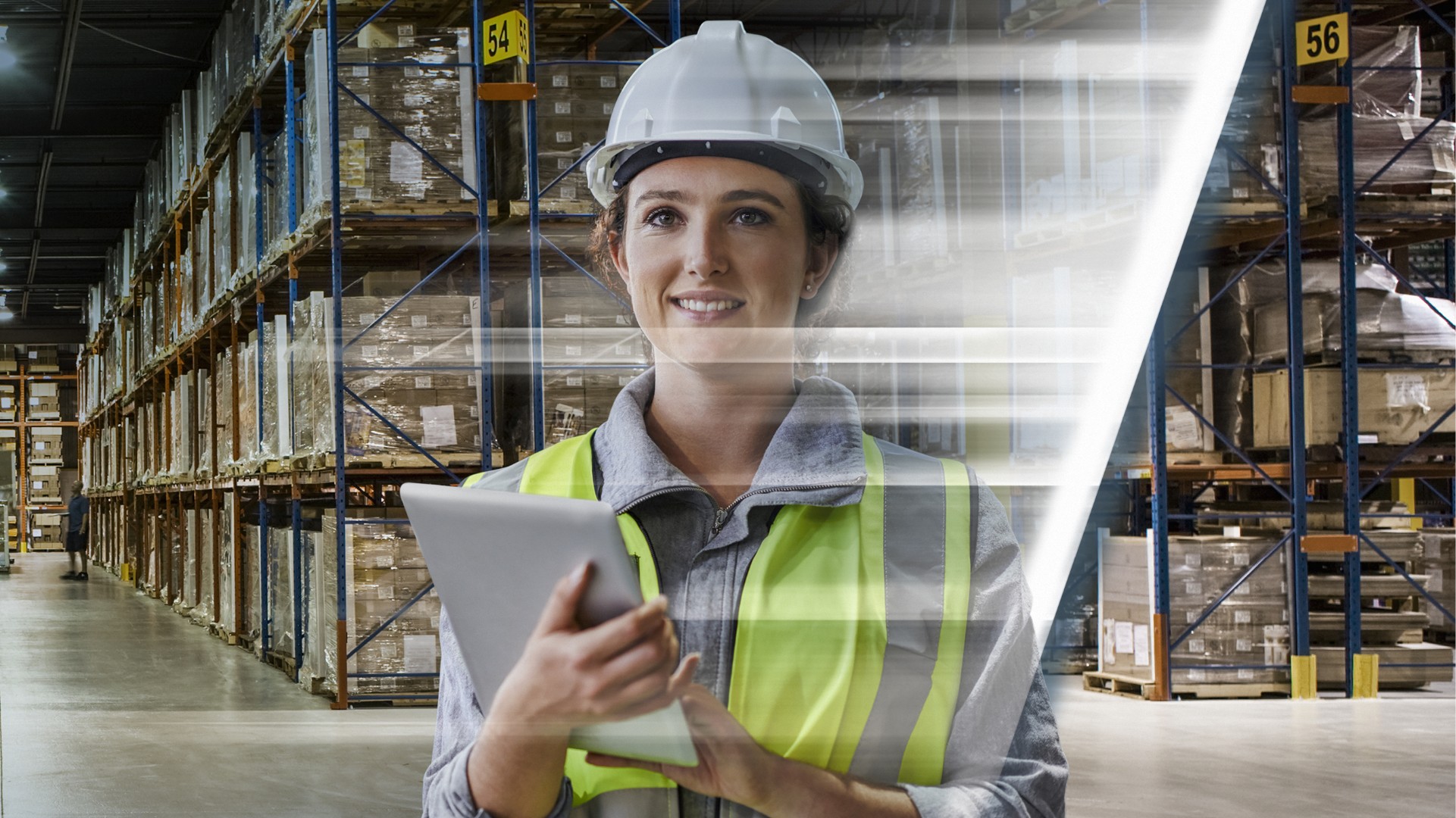 Woman in warehouse with tablet